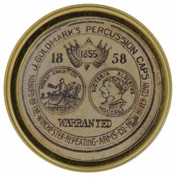 Cap box, 1-3/4" diameter, empty, with antique style label marked, J. Goldmark's Percussion Caps 1858 Warranted, Manf'd by the Winchester Repeating Arms Co. New Haven Conn.