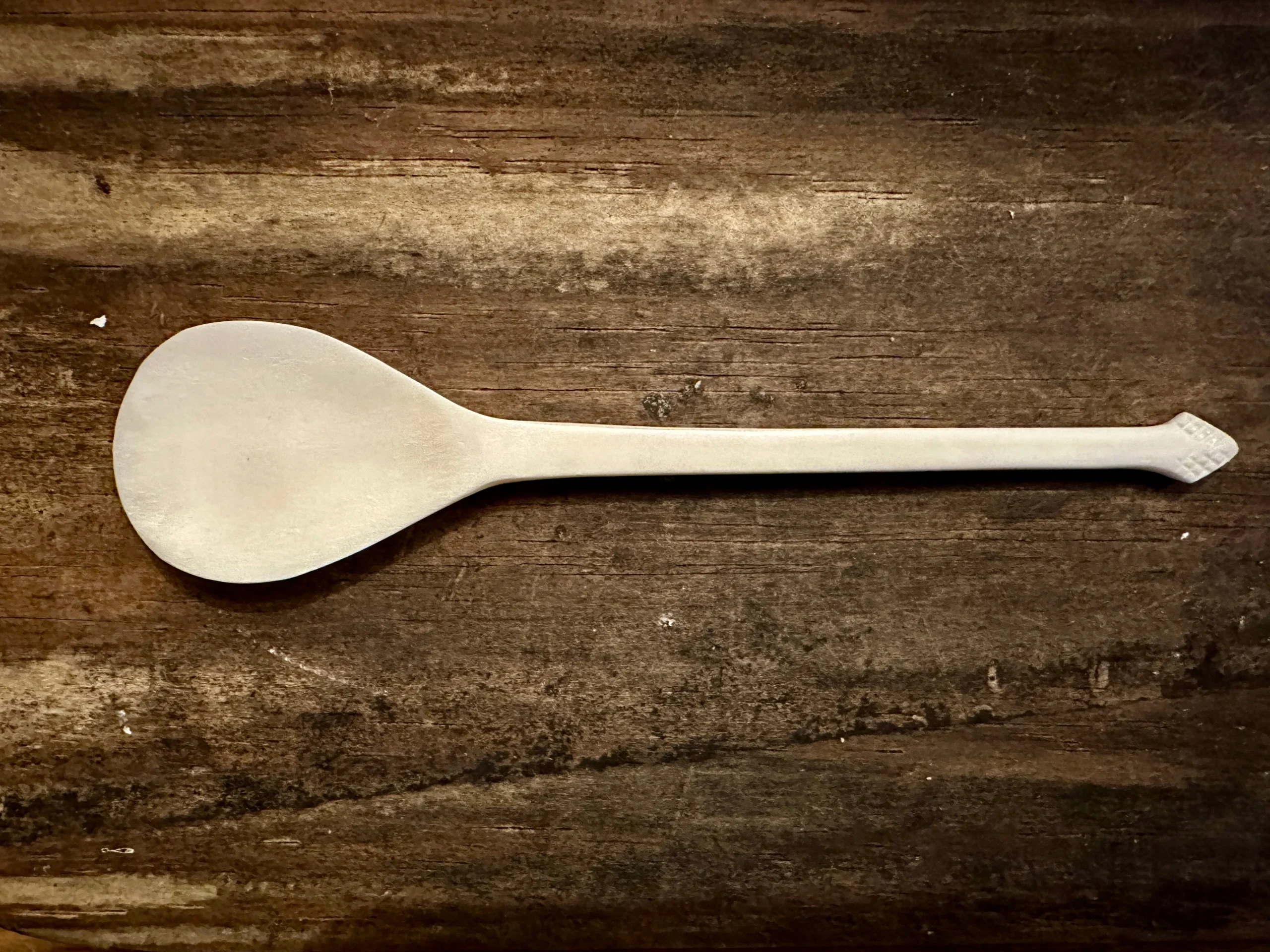 Feather finial bone spoon